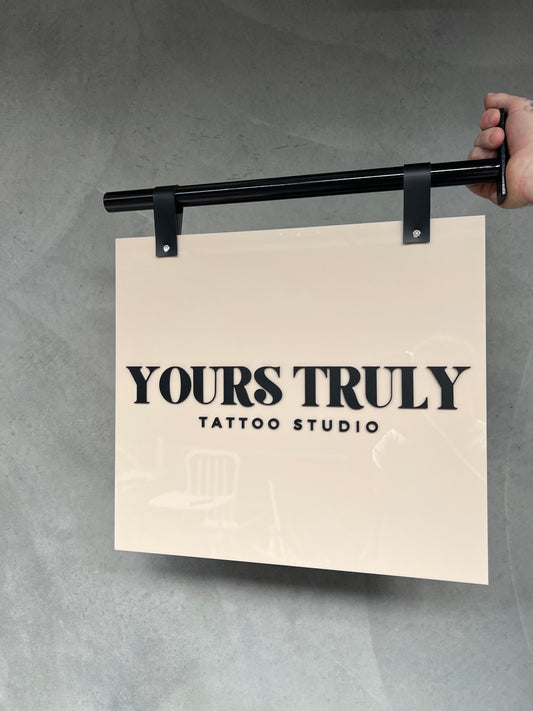 Hanging signage. Pole + acrylic sign